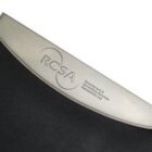 Close-up of a metallic plaque attached to a dark leather surface. The plaque is engraved with the letters RCSA and additional text in smaller font under it. The plaque has a sleek, curved design.