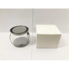 A clear plastic paint can with a metal lid and a white box beside it on a white background.