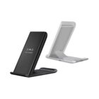 Two wireless fast chargers, one black and one white, shown from different angles.