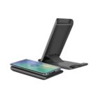 Black wireless charging stand with a smartphone placed on it, shown in an open position.