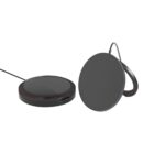 Two sleek, round wireless chargers are shown. Both are black with minimalistic designs. One charger is lying flat on a surface while the other is positioned vertically with a support stand and cable attached.