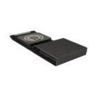 A sleek, black wireless charging pad with an integrated design. It features two distinct sections: one for charging a device and a textured compartment for cable storage. The charging pad has a circular symbol indicating wireless charging capabilities.