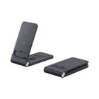 Two black foldable wireless charging stands are shown. One is positioned upright with a phone resting slot, while the other is folded flat. Both have circular charging pads and minimalistic designs.