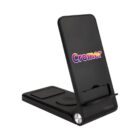 A sleek black foldable wireless charging stand with the word Cromer printed in colorful letters on the front. It features a non-slip surface and multiple charging areas for devices.