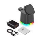 A black charging station with a circular dock, featuring multicolored LED lights at the base. Included are a black wall adapter, a USB charging cable, and a user manual.