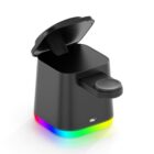 A black, open-top trash can with a circular button on the side and a colorful LED light strip at the base, displaying a gradient of colors including red, yellow, green, and blue.
