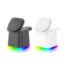 Two sleek, cube-shaped wireless phone chargers, one black and one white, with circular tops. Both feature a strip of multicolored LED lighting at the base. The black charger is on the left, the white on the right, against a plain background.