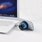 Laptop and smartphone with a small speaker.
