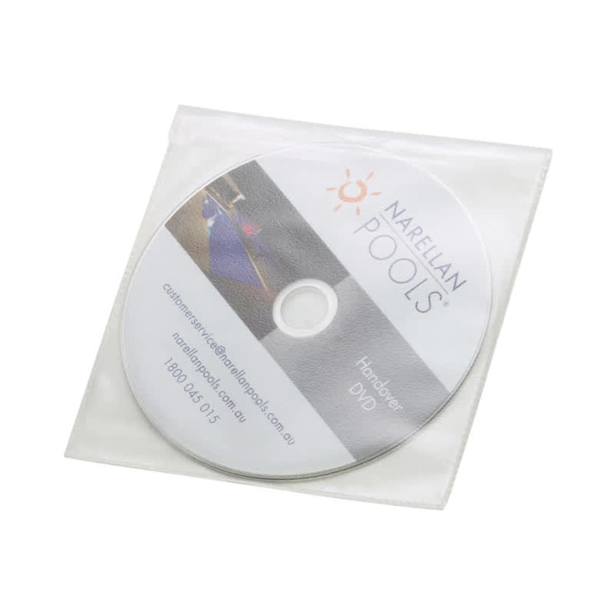 A CD labeled Narellan Pools Handover DVD in a transparent plastic sleeve, featuring contact information and a logo with an orange sun design.