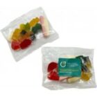 Two clear plastic bags containing assorted colorful gummy candies.