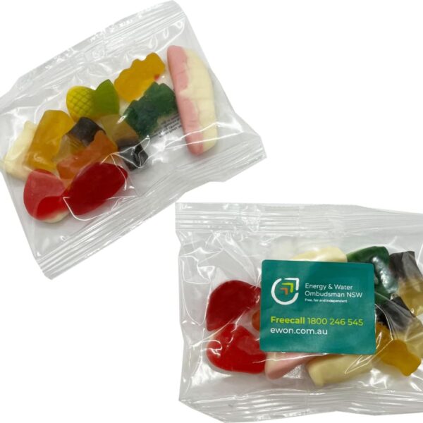 Two plastic bags of assorted gummy candies, one with a green EWON label and contact details.