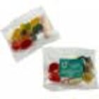 Two small clear bags containing assorted colorful gummy candies.