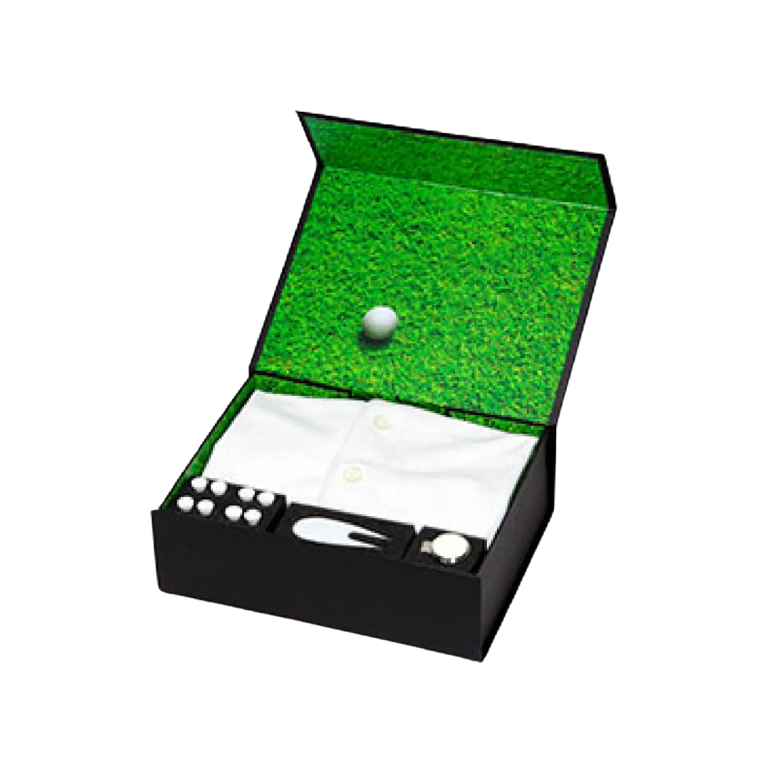 Introducing the Callaway Custom Polo Gift Set: a sleek black box with a custom polo shirt, tees, golf ball, and divot repair tool. The inside lids grass-like texture adds an authentic touch, making it perfect for any golf enthusiast!.