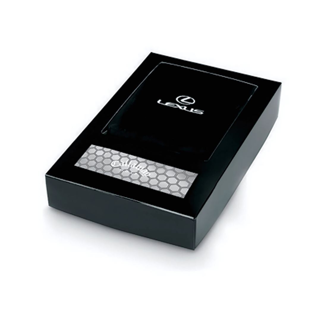 The Callaway Promotional Golf Set is housed in a sleek, rectangular black box with the Lexus logo on top. Inside, a honeycomb pattern complements a metallic surface featuring the word Sublime. Its an exquisite gift for Callaway and golf set enthusiasts.