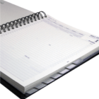 Open spiral-bound Halifax Premium Yearly Diary with lined pages and index tabs on the side.