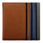 Three Launceston A5 personalised notebooks in brown, blue & gray covers with black elastics.