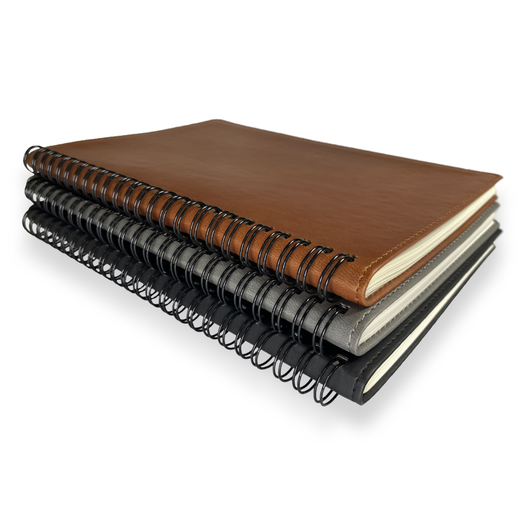 Set of three University Premium Branded A5 Notebooks in brown, gray, and black covers.