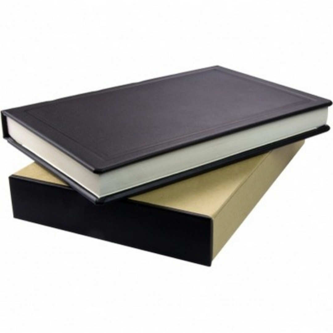 A closed Yarmouth Deluxe Leather Journal resting on a tan and black box.