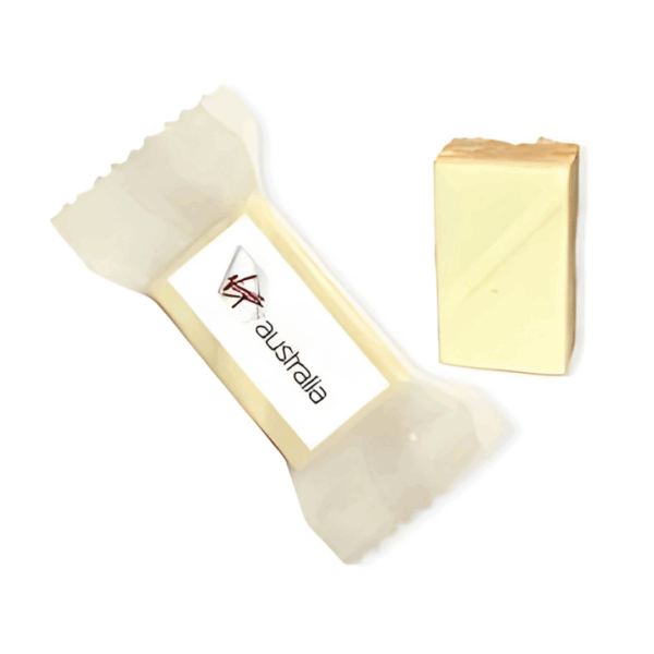 Lemon yoghurt mini bar with Australia-themed label beside a piece of the same bar.