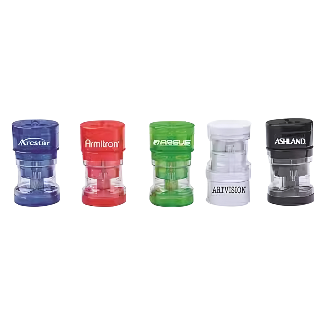 Five Basic Round Travel Adaptors in different colors on a white background.