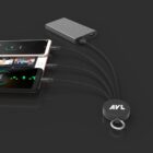 Multi-device charging hub connecting two phones and a power bank on a dark background.