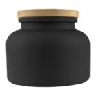 Matte black jar with a round body and a flat, light brown wooden lid.