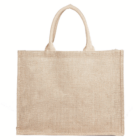 The Kala Jute natural Bag is a plain beige tote with two handles shown on a white background.