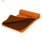An orange Everglades double layer cooling towel partially unrolled on a white background.