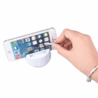 Hand using stylus on smartphone in a white Three in One Phone Chair.