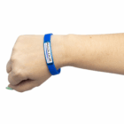 A hand wears a blue Dome Printed Silicone Band.