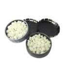 Two open Classic Mints in Branded Tins, filled with small white mints, one lid off to the side.