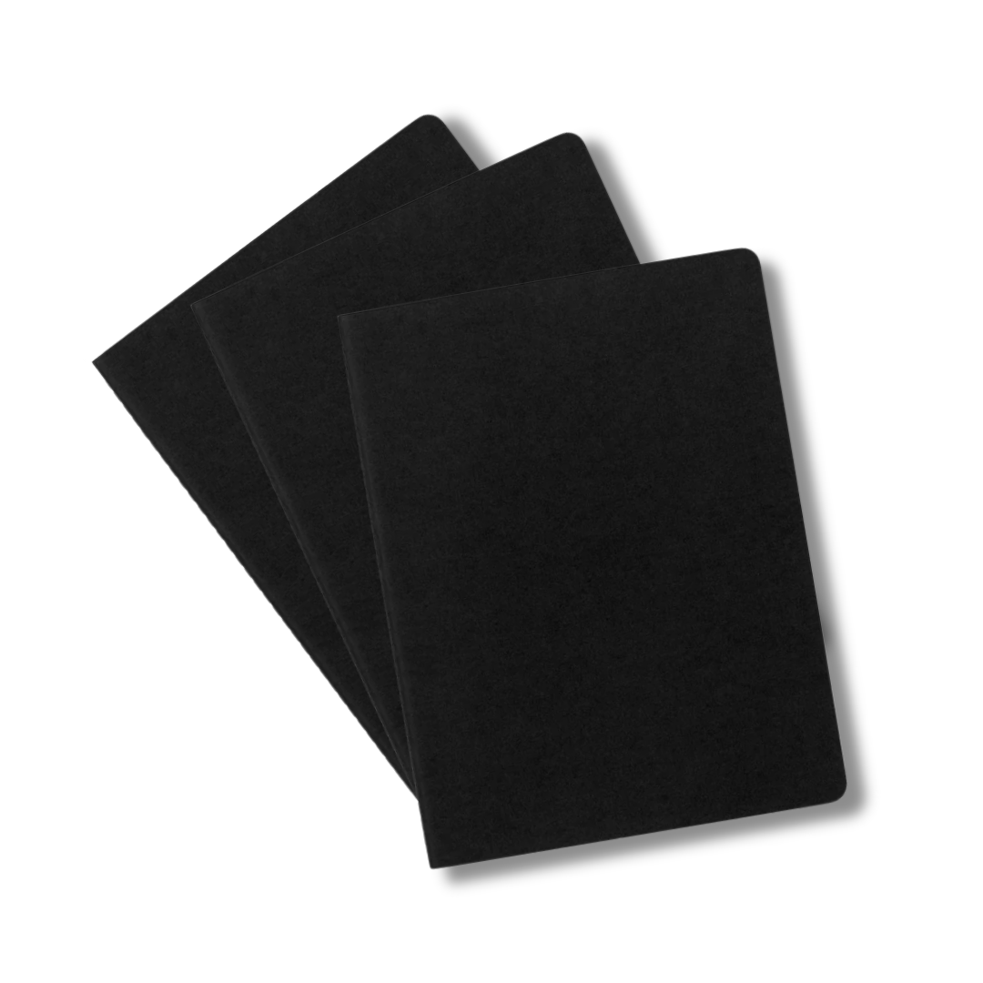 Three Moleskine X-Large Cahier Journals stacked on a white background.