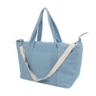 Light blue fabric tote bag with beige adjustable shoulder strap and handles.