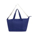 Blue tote bag with two short handles and one long beige shoulder strap, on white background.
