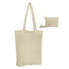 A beige foldable tote bag with long handles next to a small matching pouch with a zipper. The tote is designed to be stored compactly in the pouch.