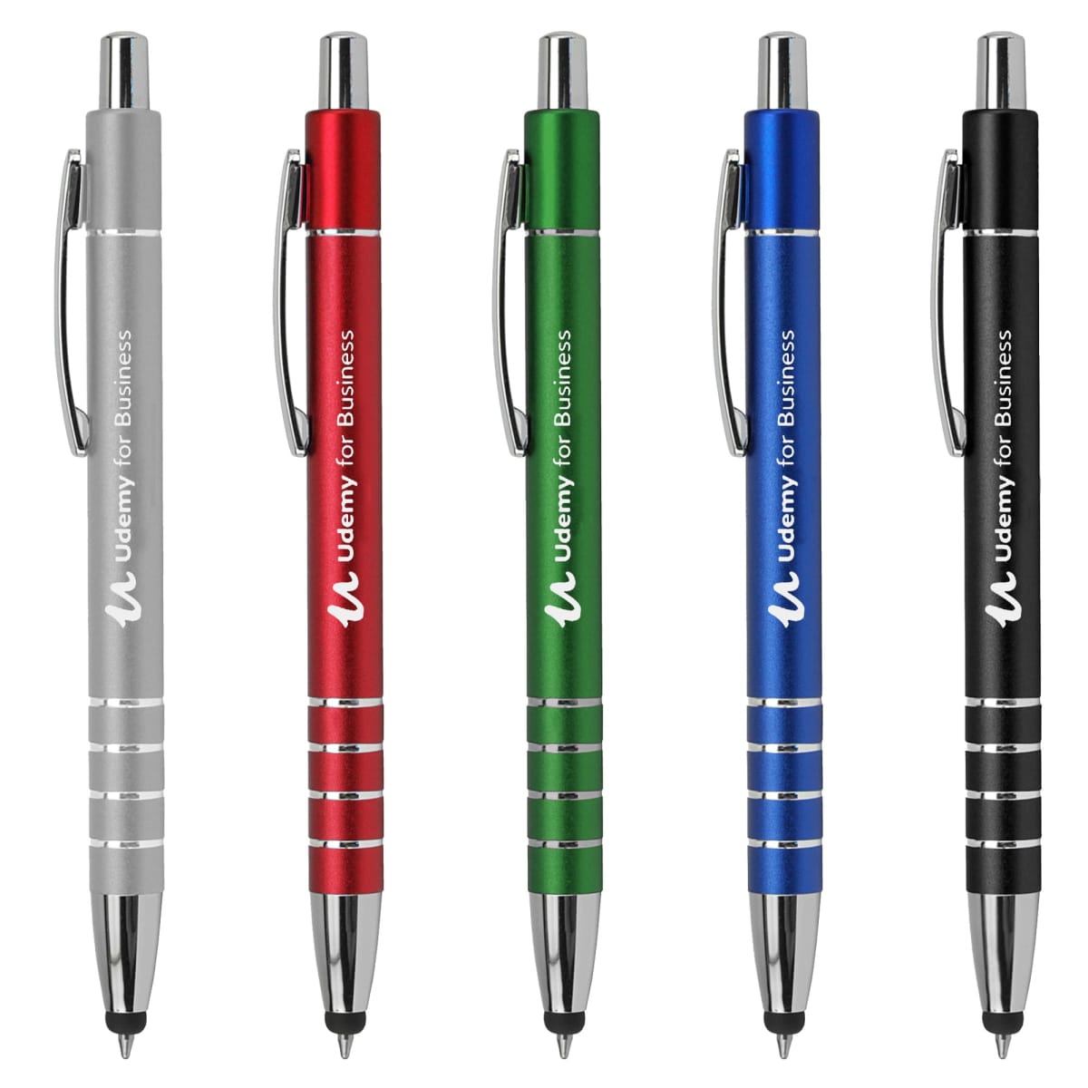 Five pens in silver, red, green, blue, and black with Udemy for Business printed on them.
