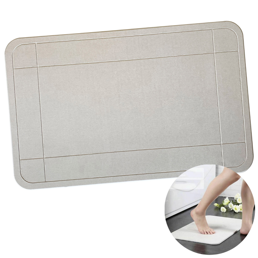 Kyoto Promotional Drying Bath Mat in gray; beveled rectangular design with foot stepping on.
