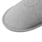 Close-up of the toe area of a gray felt slipper with visible stitching.