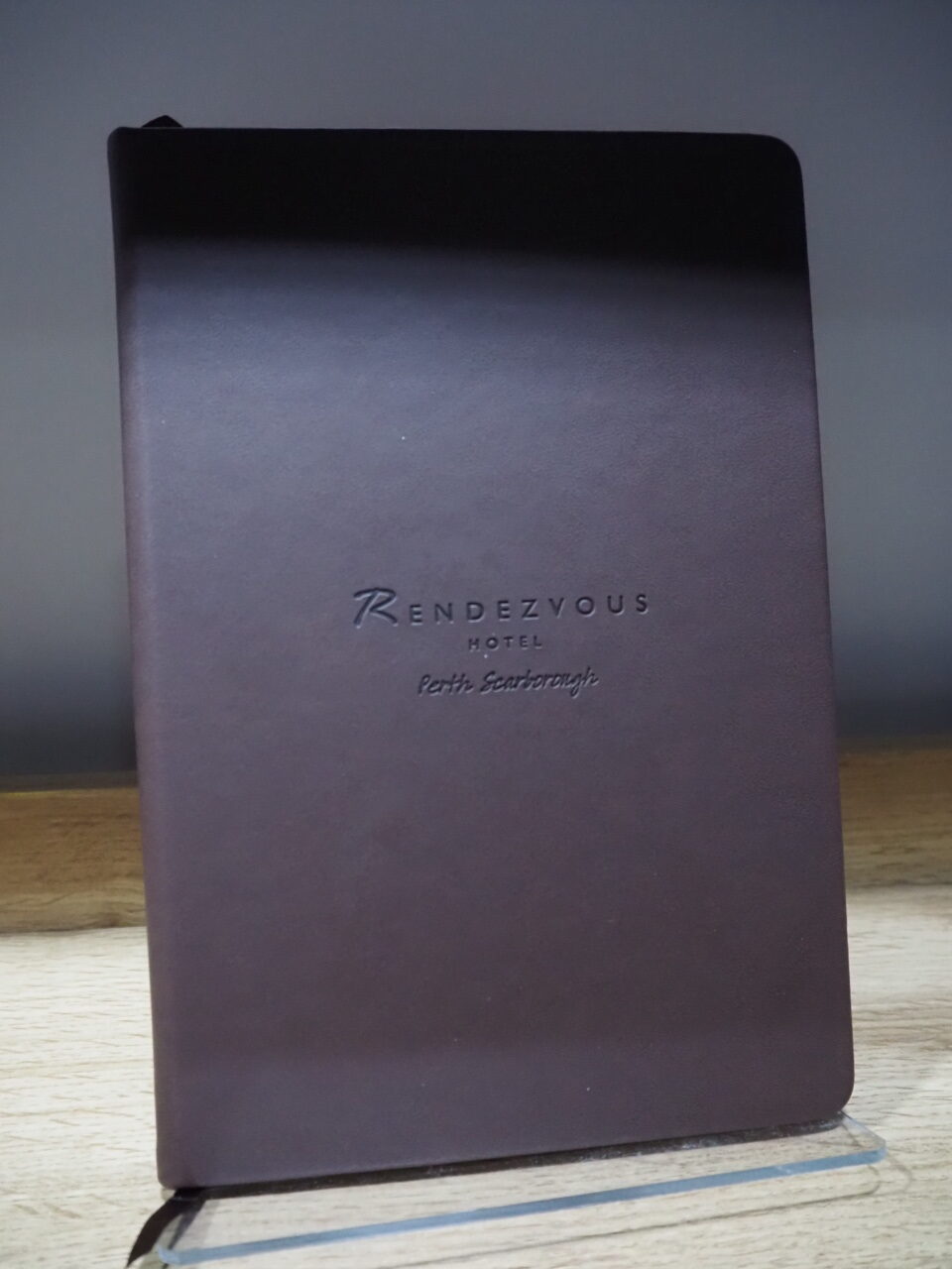black notebook with minimal branding