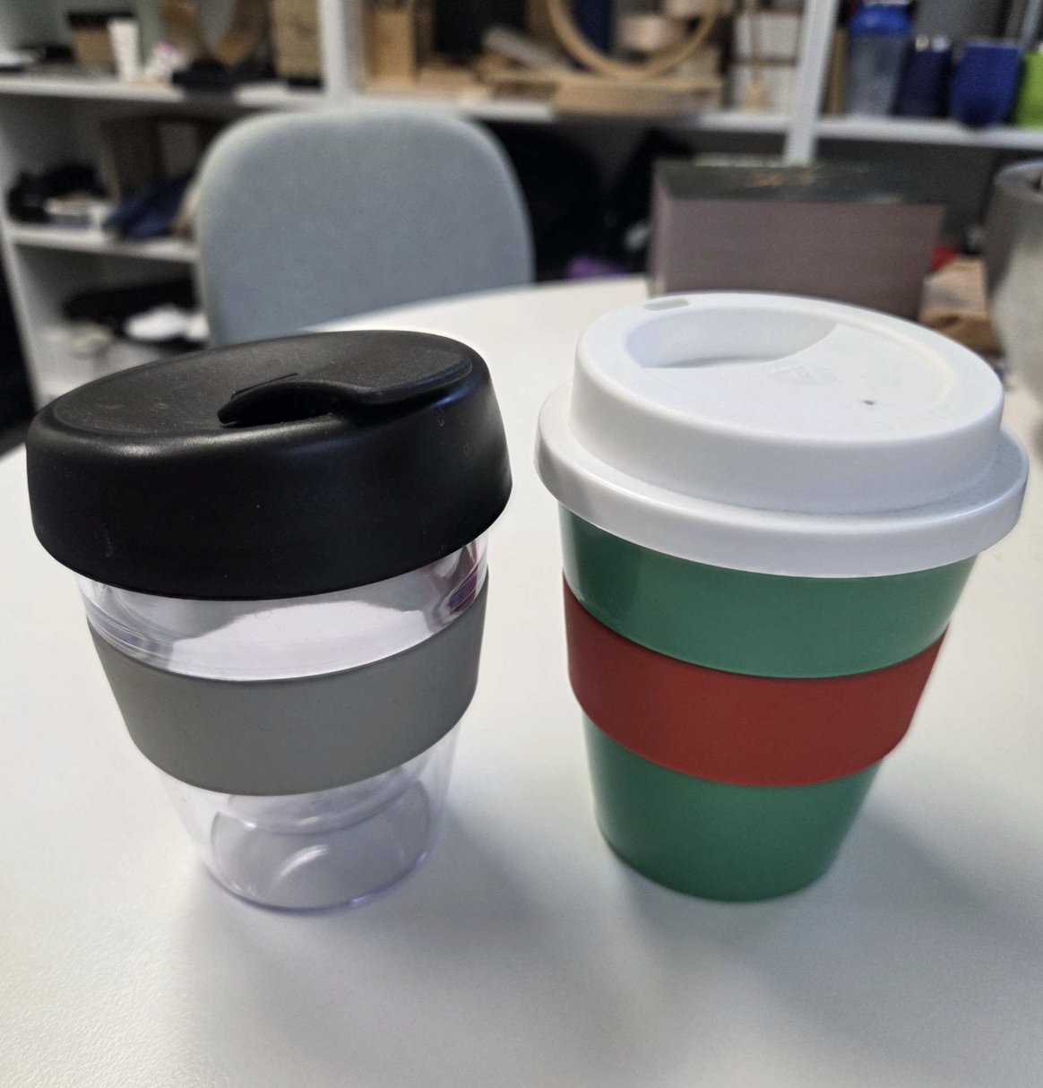 2 reusable cups on a table