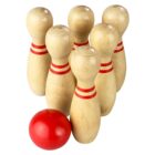 Six wooden bowling pins with red stripes and a red ball in front.