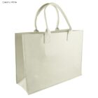 A creamy white shopping tote bag with two sturdy handles and a rectangular base. The bag has a plain design, suitable for carrying groceries or personal items.