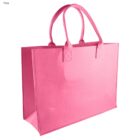 A pink fabric tote bag with two sturdy handles. The bag has a rectangular shape with a flat base, designed for carrying items. The material appears durable, suitable for shopping or daily use.