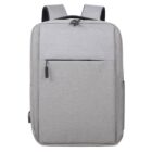 A sleek, gray backpack with a minimalist design. It features a main zipper compartment, a front zipper pocket, and padded shoulder straps. The fabric appears durable and the style is modern and simple.