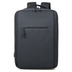 A sleek, minimalist black backpack with a smooth texture. It features a front zip pocket, padded shoulder straps, and a rectangular shape. The bag is designed for simple and functional use, suitable for commuting or casual wear.