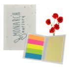 A set of colorful sticky notes in orange, pink, green, blue, and yellow, next to a light gray booklet with Monarch Nursery and a trowel logo. Red poppy flowers are placed behind the booklet.