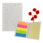 A white folder with multicolored sticky notes inside, featuring shades of pink, orange, green, blue, and yellow. Next to it are vibrant red poppies with green stems, set against a plain white background.