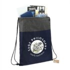 Drawstring bag labeled Sage Philosophy with books and brochures inside.