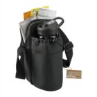 Black sling bag holding a water bottle, notebooks, and a tag attached to the side.