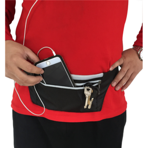 Person in red shirt with a Customised Workout Waist Bag holding phone and keys.